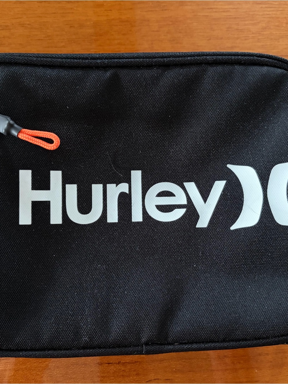 Hurley Black Lunch Box with molded plastic insert, orange handle, zip pouch
